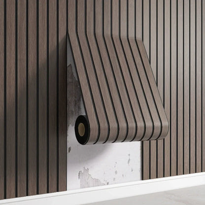 Nutshell woodgrain wallpaper roll in dark brown vertical slat pattern peeling to reveal plaster wall