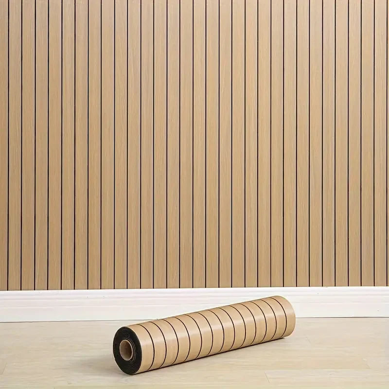 Nutshell woodgrain wallpaper vertical slat design installed with white baseboard and a rolled sample on floor