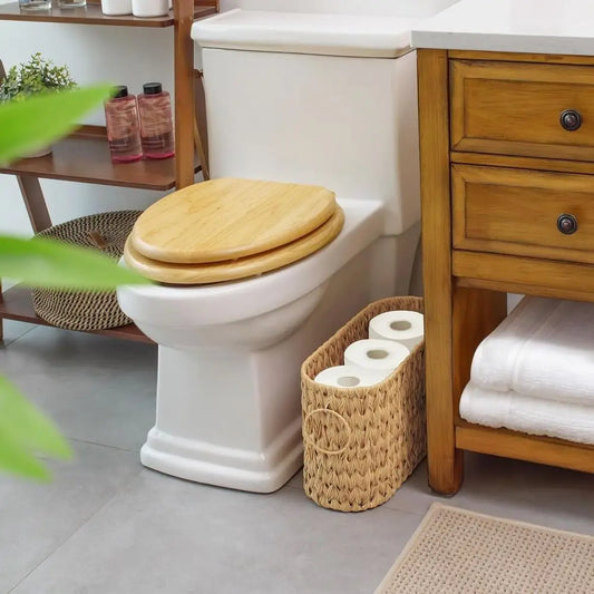 Wicker Woven Toilet Paper Storage basket placed next to a toilet in a stylish bathroom