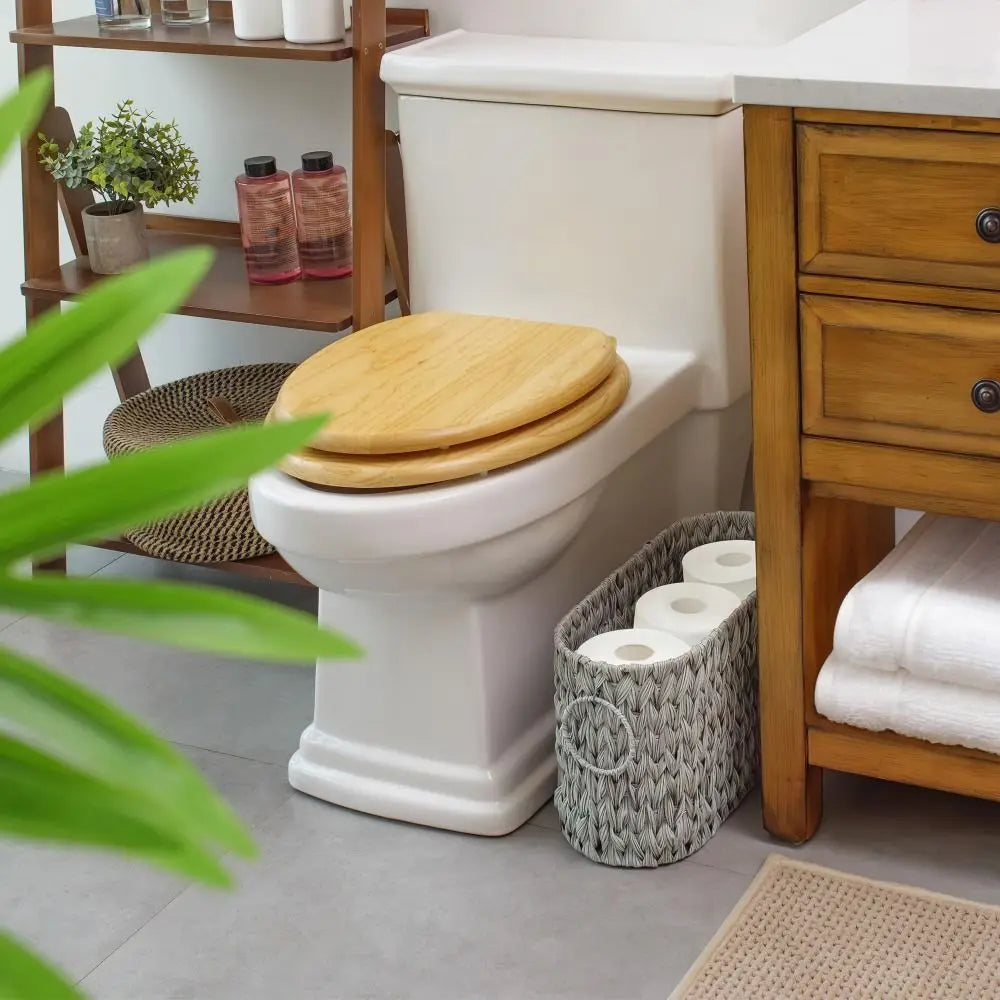 Wicker Woven Toilet Paper Storage next to a white toilet in a modern bathroom setting
