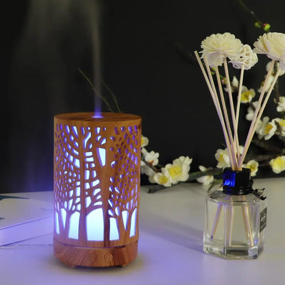 Nutshell wood grain essential oil diffuser with tree cutout design and blue LED light emitting mist