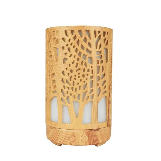 Nutshell wood grain essential oil diffuser with intricate tree cutout design and control buttons