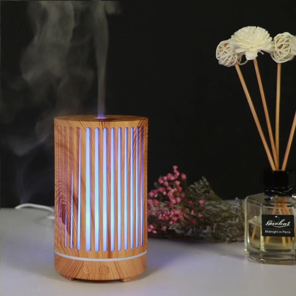Nutshell wood grain essential oil diffuser with vertical slats and blue light emitting mist