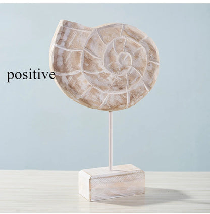 Nutshell wooden ocean theme decorations with a carved spiral shell design on a stand