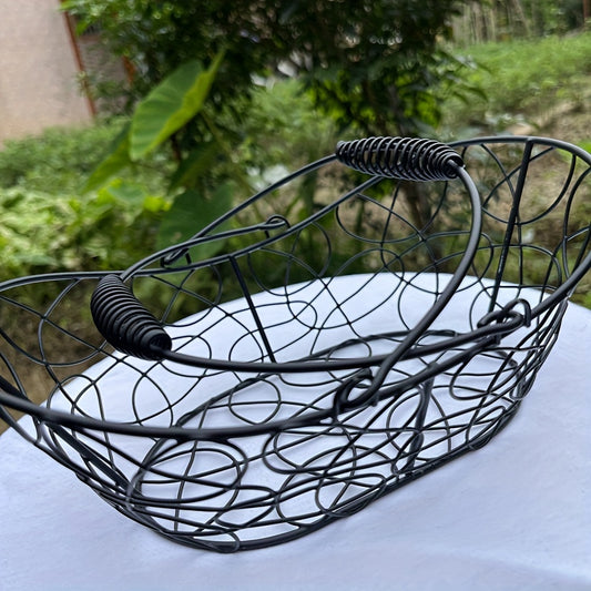 Nutshell wrought iron egg basket with decorative handles for elegant kitchen storage