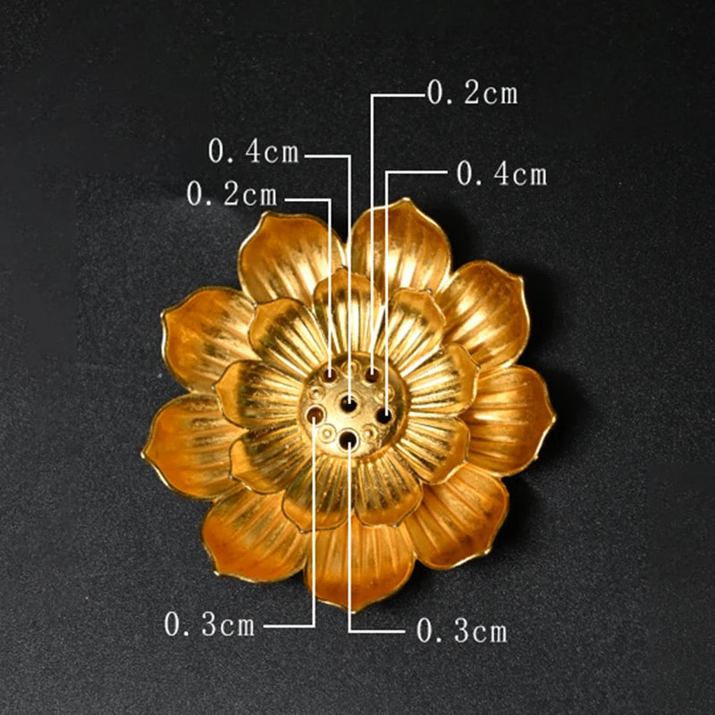 Golden Zen lotus incense burner by Nutshell with detailed measurements on black background