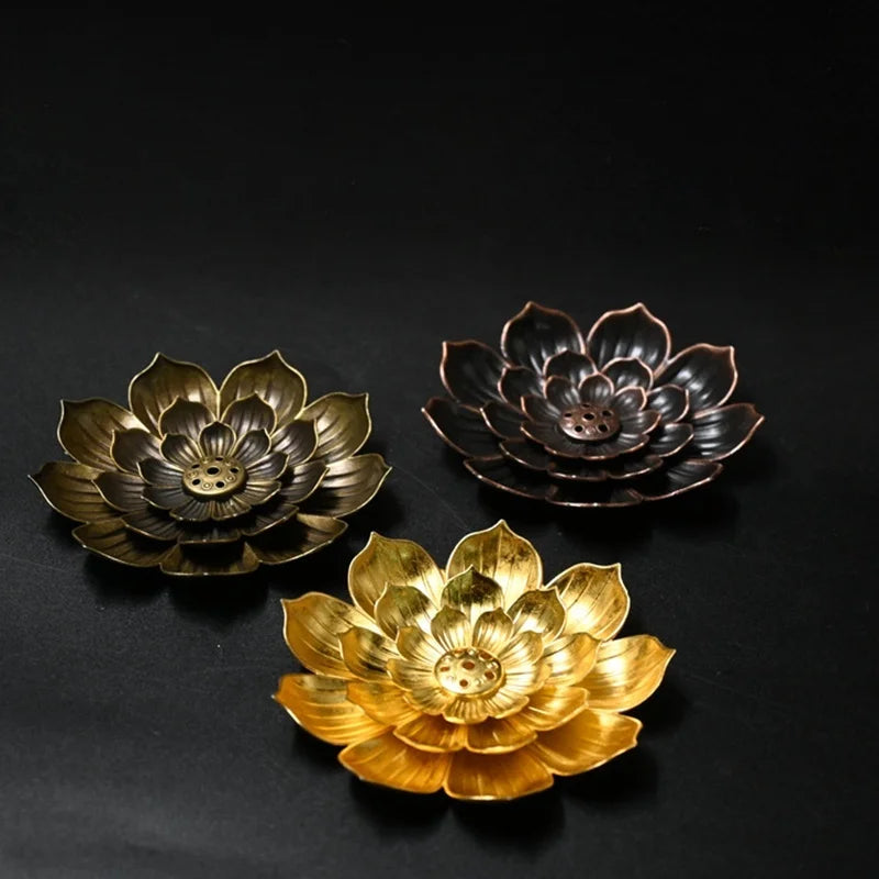 Nutshell Zen lotus incense burner in gold bronze and black lotus flower designs for incense holding