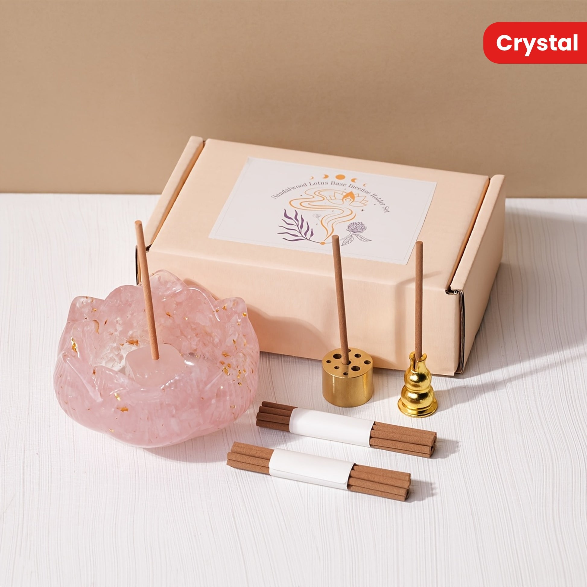 Zen lotus incense burner set featuring a pink crystal holder with incense sticks and gold accessories
