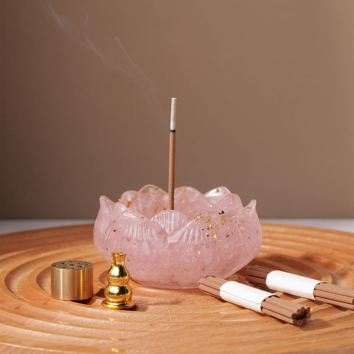 Zen lotus incense burner set in pink with incense stick and accessories on a wooden tray